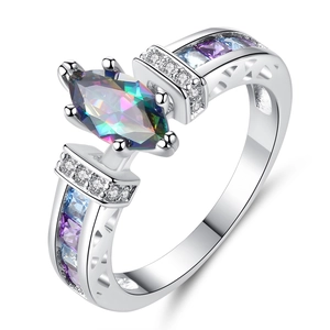 Detail view of silver ring with marquise rainbow zircon and channel-set blue gems