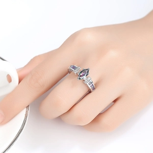 Silver ring with colorful marquise zircon and purple side stones worn on finger