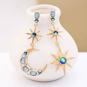 Bohemian gold star and moon mismatched earrings with blue gemstones and crystals