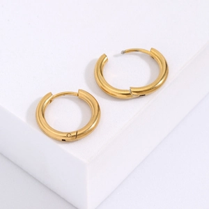 Macro shot of chunky gold stainless steel hoop earrings with secure click-top closure