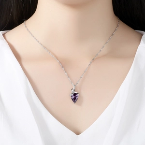 Elegant purple teardrop crystal pendant necklace with silver water wave chain on woman
