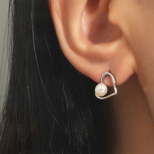 Elegant silver heart-shaped pearl earrings with zirconia accents for women