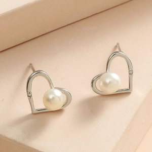Elegant silver heart-shaped pearl earrings with cubic zirconia accent in minimalist style