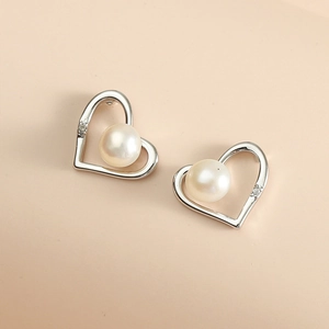 Elegant heart pearl stud earrings with silver metal frame and micro zircon stone accents