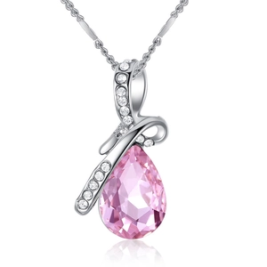 Detailed macro view of pink teardrop crystal pendant on silver necklace with zircons
