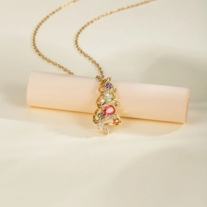 Golden Christmas tree pendant necklace with colorful zircons and stones on fine chain