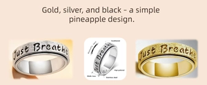 Close-up of 6mm stainless steel spinning ring with Just Breathe engraving and matte finish