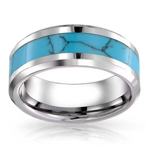 Detailed macro view of the silver steel ring featuring inlaid blue turquoise with black veins