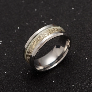 Luminous stainless steel music note ring with staff pattern on a black background