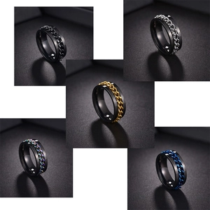 Close-up of rotatable chain rings in black, gold, silver, blue, and rainbow titanium steel