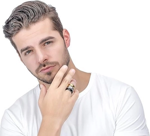 Close-up of a man wearing a set of black, gold, and silver 8mm matte stainless steel rings