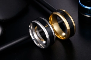 Close-up of smart temperature sensor ring in stainless steel with digital display
