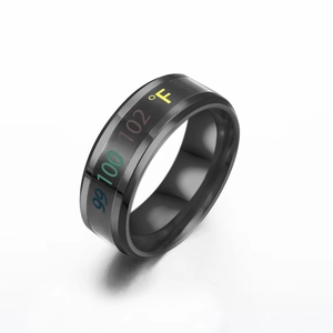 Macro shot of black stainless steel smart ring showing colorful Fahrenheit temperature display
