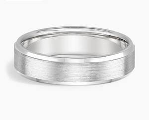 Macro shot of 8mm matte brushed stainless steel ring showing polished beveled edges