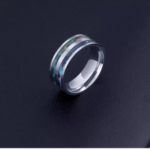 Polished titanium steel ring with colorful abalone shell inlay on black leather background