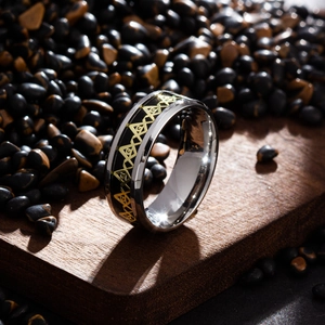 Macro detail of men's stainless steel Masonic ring with gold Eye of Providence symbol
