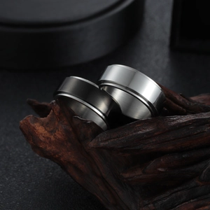 Minimalist brushed stainless steel spinning ring in black and silver for men