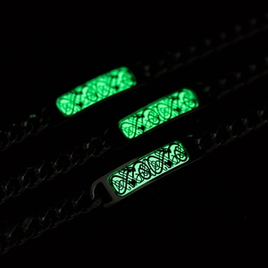 Titanium steel bracelet with luminous green dragon pattern on black chain links