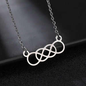 Minimalist silver steel necklace with geometric intertwined concentric knot pendant