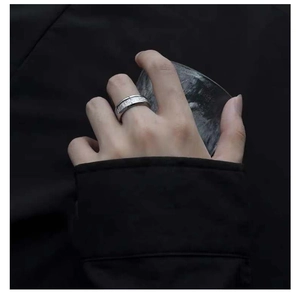 Macro shot of silver titanium steel ring with textured sandblast finish for men