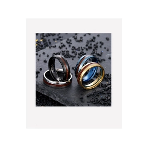 Close-up of titanium steel rings featuring distinctive wood grain inlay in four colors
