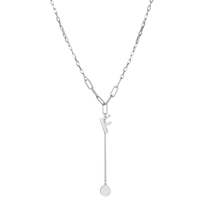 Detail of silver paperclip chain necklace with a letter F pendant and a round tag