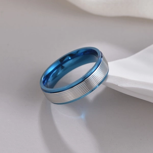 Industrial 6mm silver stainless steel ring with blue inner plating and textured grooved surface