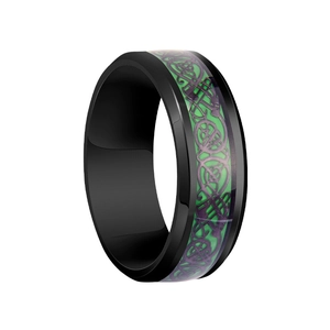 Detailed macro view of black metal ring with green and purple Celtic dragon pattern