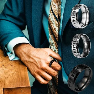 Detail of Viking Rune patterns on titanium steel rings in silver, grey and black finish