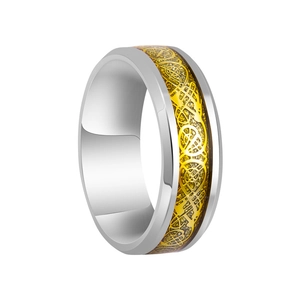 Macro view of stainless steel ring with golden Celtic knot pattern and glitter inlay