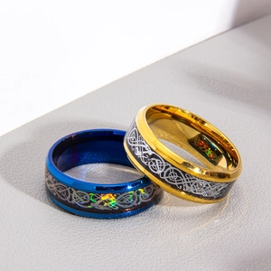 Men's polished stainless steel rings featuring blue and gold Celtic dragon patterns