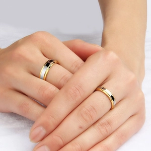 Polished tungsten steel couple rings showing gold, silver, and black multi-color metal bands