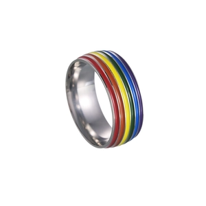 Macro detail of rainbow pride enamel stripes on a polished titanium steel ring band