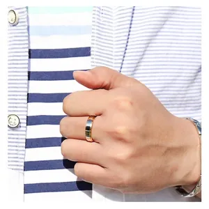 Two-tone tungsten steel men's ring in silver and rose gold worn on model's hand