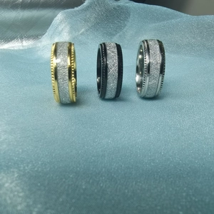 Vintage embossed titanium steel rings for men and women in gold, black, and silver colors