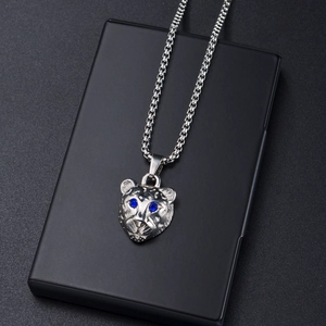 Punk style silver panther head necklace with blue rhinestone eyes and link chain