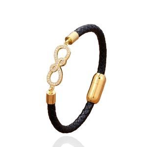 Bracelet en cuir tressé noir avec symbole de l'infini doré et fermoir magnétique chic