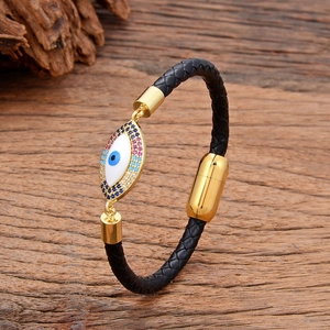 Bracelet tressé en cuir noir bohème avec breloque œil doré et fermoir magnétique