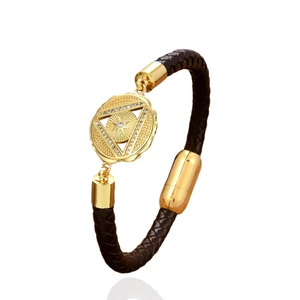 Braided brown leather bracelet with golden sunburst pendant and magnetic clasp closure