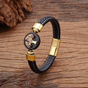 Bracelet en cuir tressé avec breloque arbre de vie doré et cristaux colorés sur bois