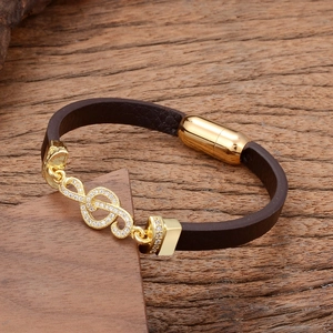 Brown braided leather bracelet with gold treble clef musical note and magnetic clasp