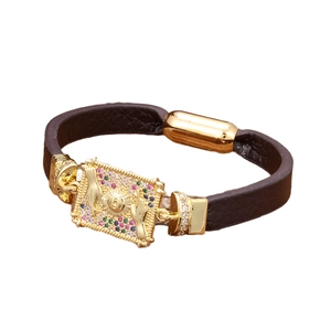 Deep brown leather bracelet with golden evil eye charm and colorful crystals