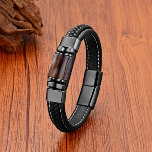 Macro view of woven black leather strap with stone beads and magnetic metal clasp