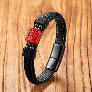Black leather woven bracelet with red cinnabar bead and Buddha head engraving
