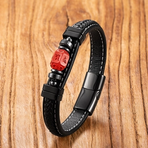 Handmade leather bracelet with red cinnabar bead and black magnetic metal clasp
