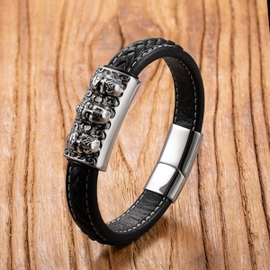 Detail of men's braided leather bracelet featuring vintage three-head Buddha silver metal plate