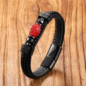 Braided black leather bracelet with red cinnabar Buddha bead and black metal clasp