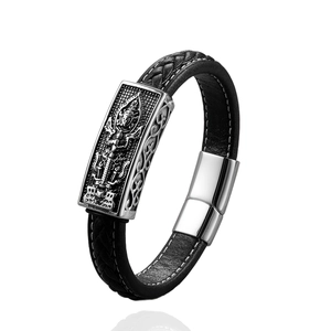 Men's punk leather bracelet with a silver religious deity carving and magnetic clasp