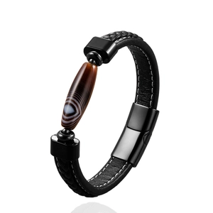 Trendy woven leather couple bracelet with brown agate stone and metal clasp on white background