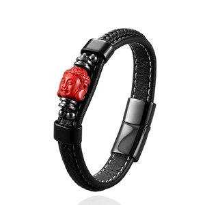 Unisex black woven leather bracelet with red Buddha head charm and steel clasp